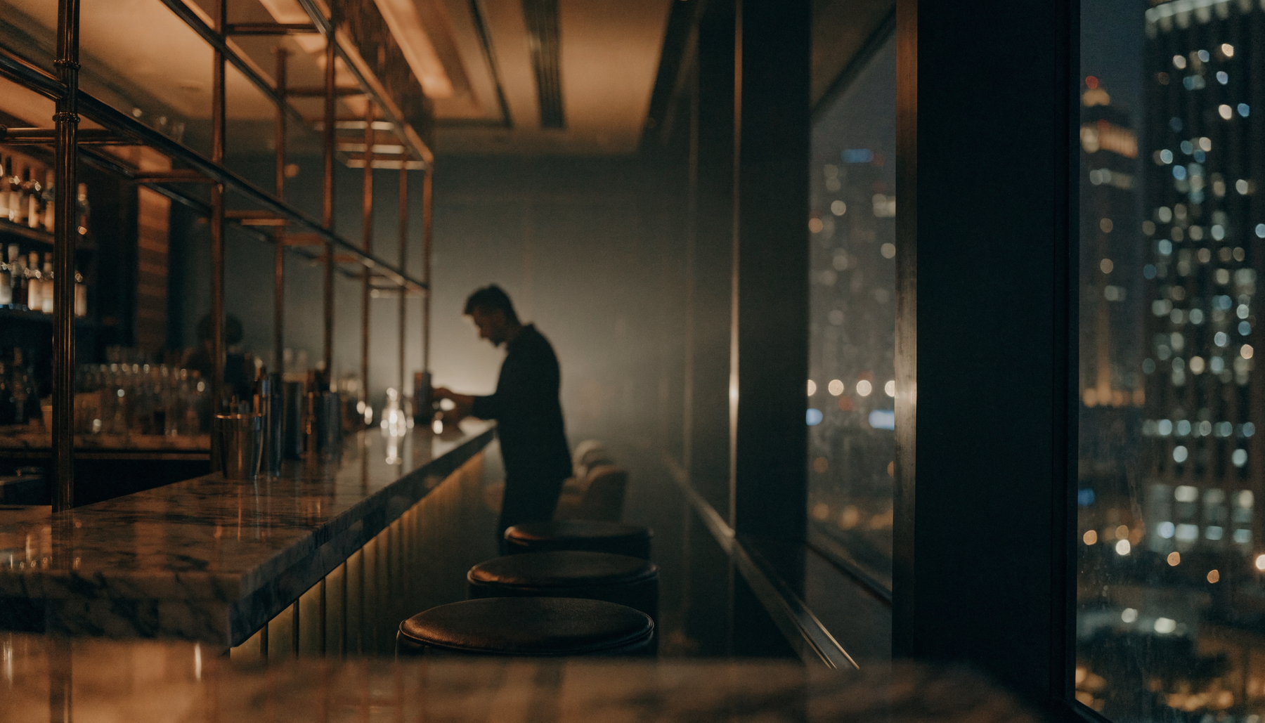Upscale dark Dubai cocktail bar at night | Addtocart Dubai UAE